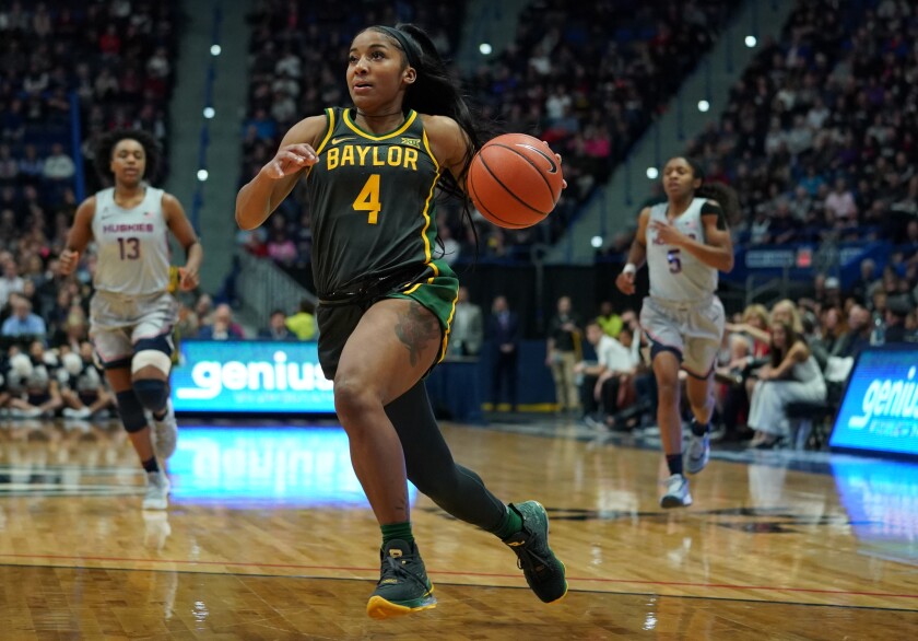 Te'a Cooper drives to the basket while playing for Baylor last season during a game against UConn.