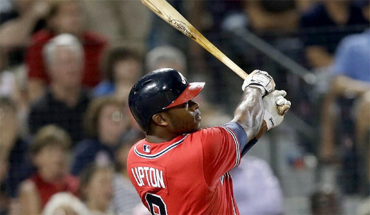 Justin Upton's sixth inning grand slam gave the Atlanta Braves the edge in the Dodgers' 8-5 loss on Friday.