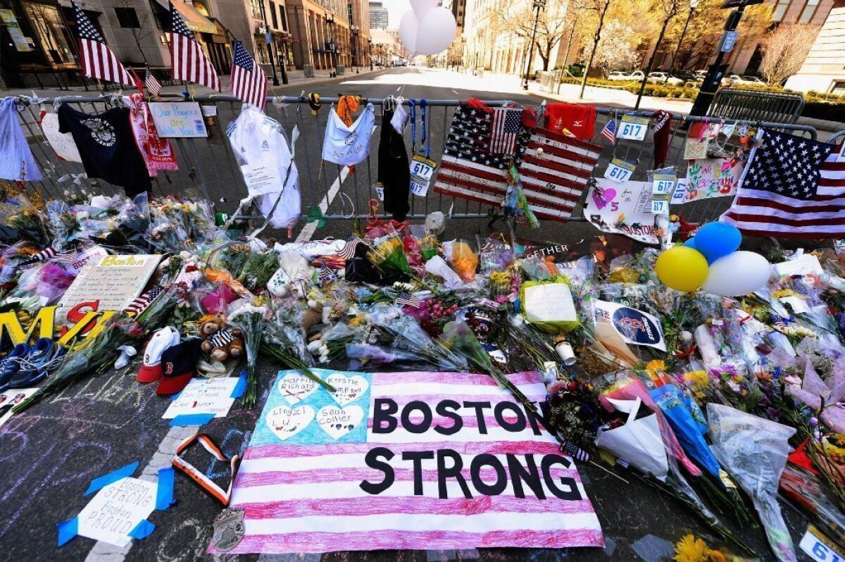 A makeshift memorial near the site of the Boston Marathon bombings at the intersection of Boylston Street and Berkley Street has been moved as city officials prepare for the reopening of the blast site.