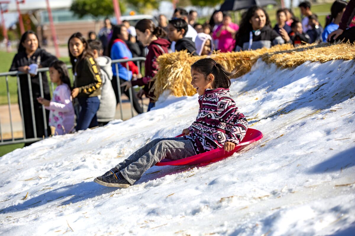 Play in the snow at Winter Wonderland in Wilmington on Dec. 7.