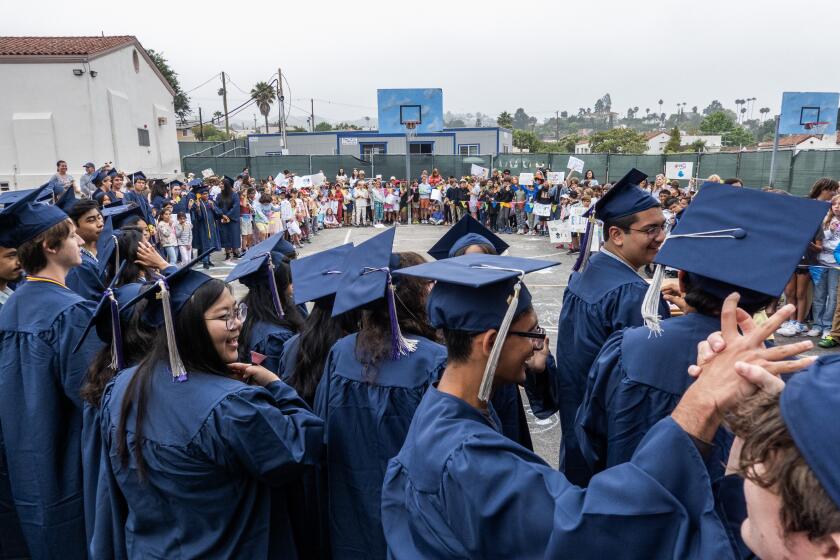 LOS ANGELES, CA - JUNE 11: Marshall High School graduates attend a ceremony at Franklin Avenue Elementary School following their senior walk on the last day of school on Tuesday, June 11, 2024. The walk is a culminating activity for the seniors - some who went to the school or have siblings who still attend. (Myung J. Chun / Los Angeles Times)