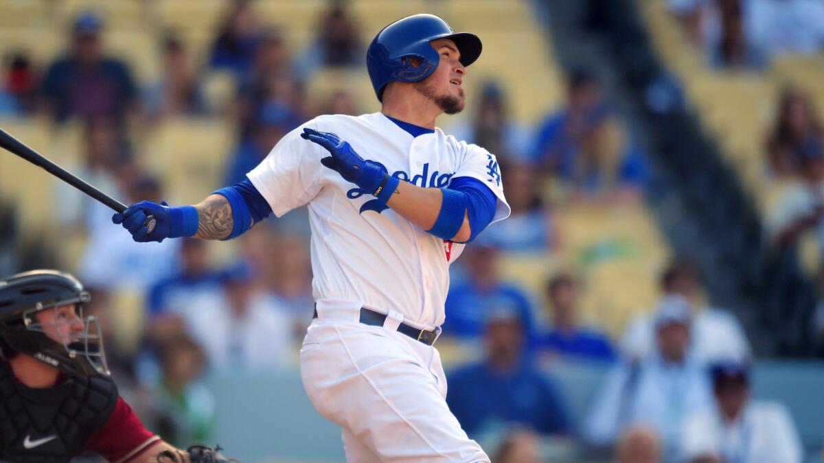 Dodgers catcher Yasmani Grandal hits a walk-off home run in the 13th inning to propel the Dodgers to a 1-0 victory over the Arizona Diamondbacks at Dodger Stadium on May 3.