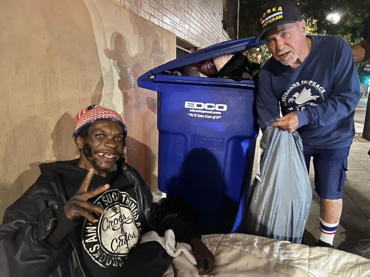 Stan Levin, 93, gave Rico Santiago the 5,000th sleeping bag in 11 years from S.D. Veterans for Peace Compassion Campaign.