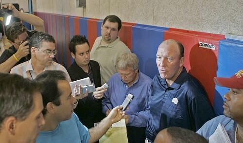 Clippers coach Mike Dunleavy, right, answers reporters questions as he talks about the upcoming season.