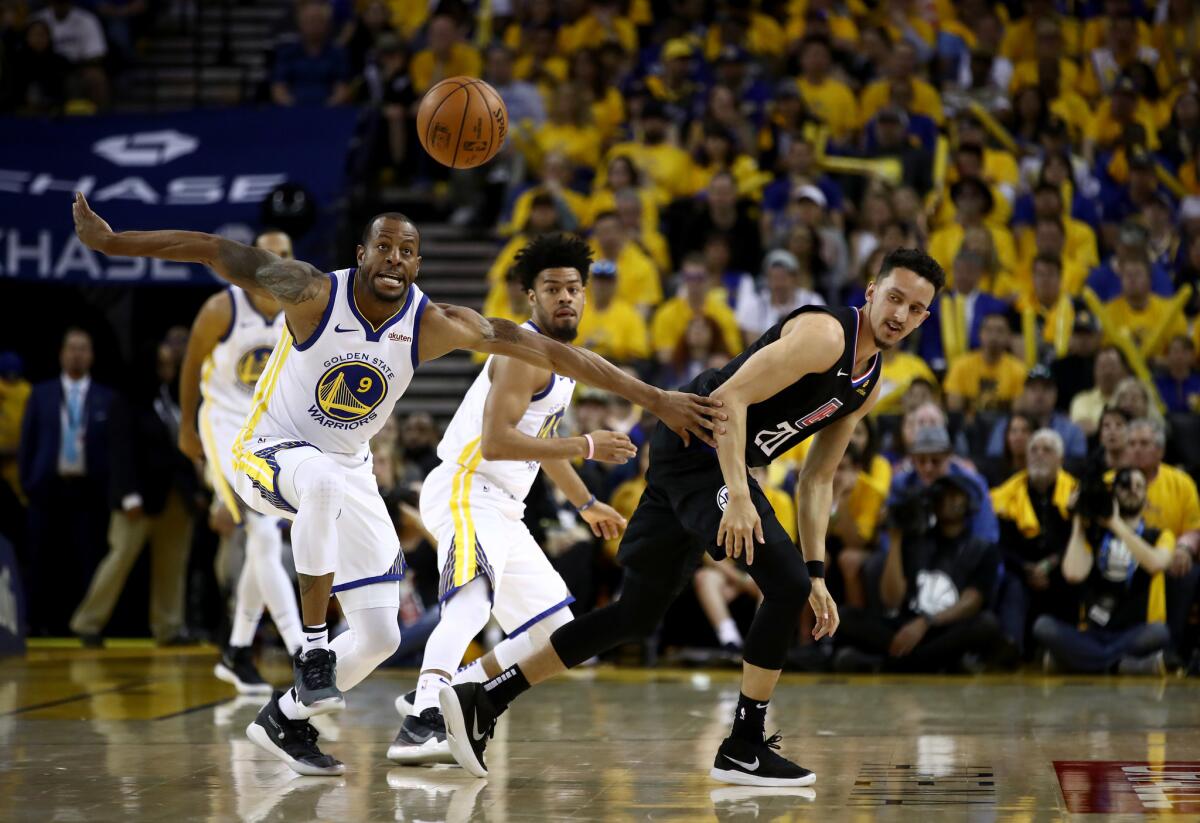Golden State Warriors' Andre Iguodala (9) steals the ball from Clippers' Landry Shamet (20) of the during Game 1 of the first round of the NBA playoffs on Saturday in Oakland.