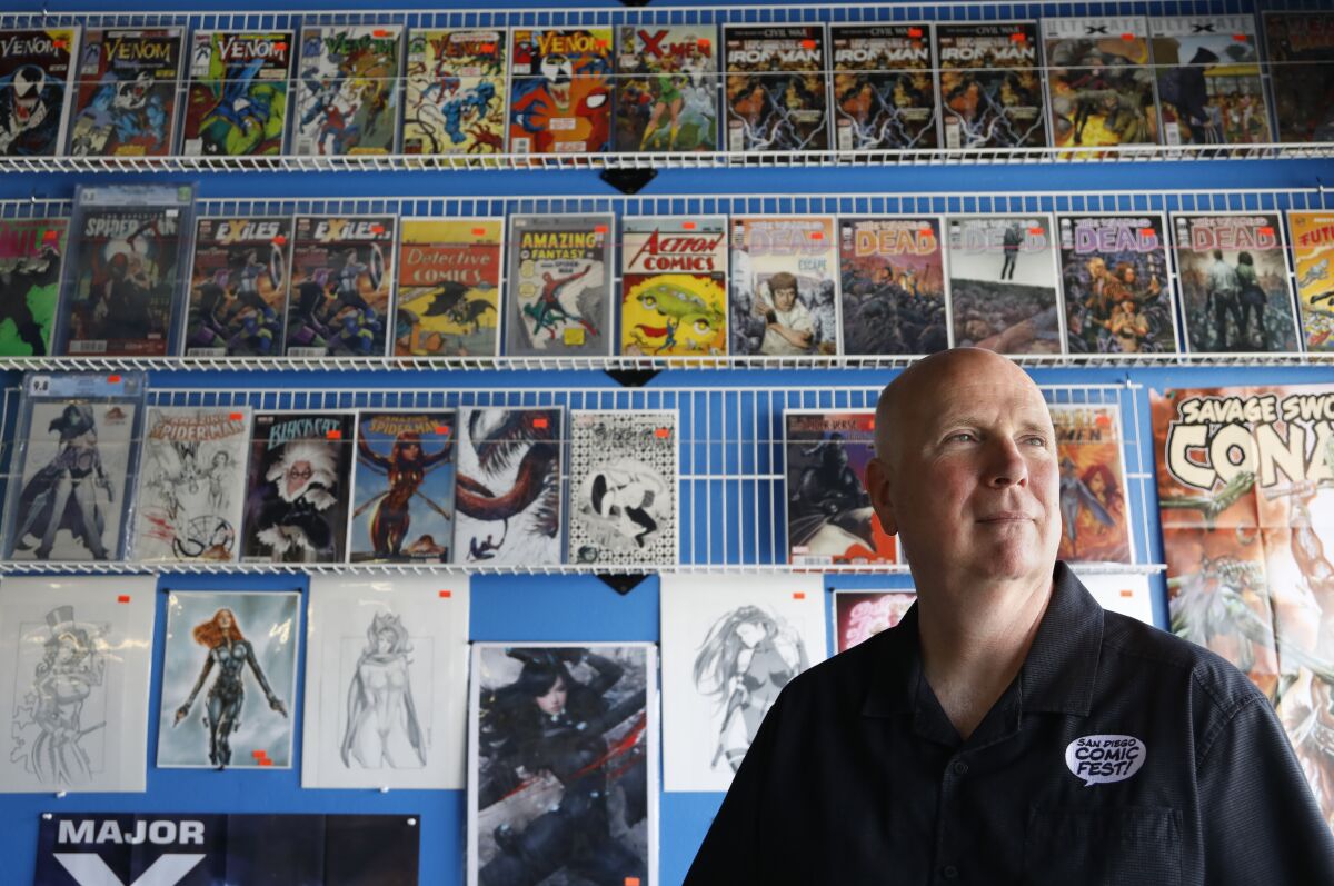 Pictured at a Kearny Mesa comics store, Mike Towry, a co-founder of Comic-Con, has attended most of the San Diego conventions. 