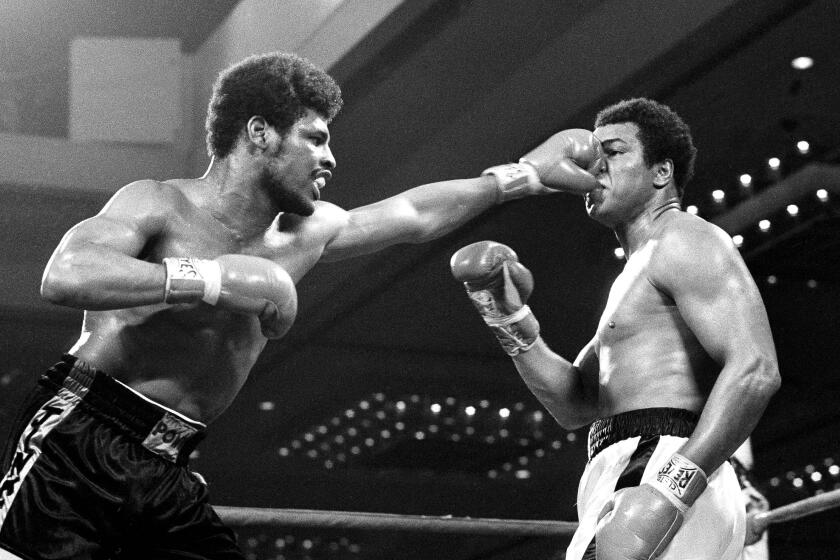 Fist of challenger Leon Spinks flattens the nose of heavyweight champion Muhammad Ali in the title fight at Las Vegas, Nev., Feb. 15, 1978. Officials awarded the fight and the title to Spinks in a split decision. (AP Photo)