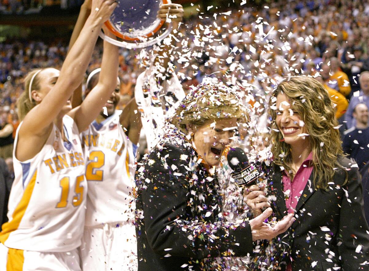 Tennessee coach Pat Summitt has confetti dumped on her by players Alicia Manning (15) and Alex Fuller (2) on Feb. 5, 2009, after the Lady Vols defeated Georgia, earning Summitt her 1,000th career coaching victory.