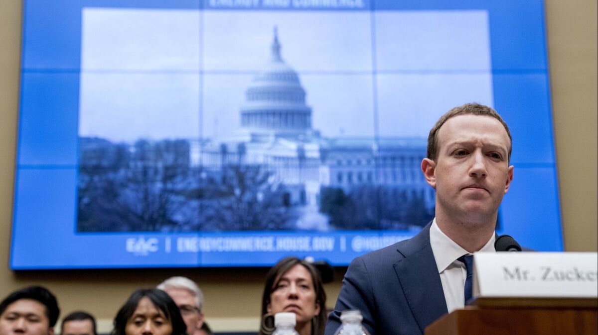 Facebook CEO Mark Zuckerberg pauses while testifying before a House Energy and Commerce Committee hearing Wednesday on Capitol Hill.