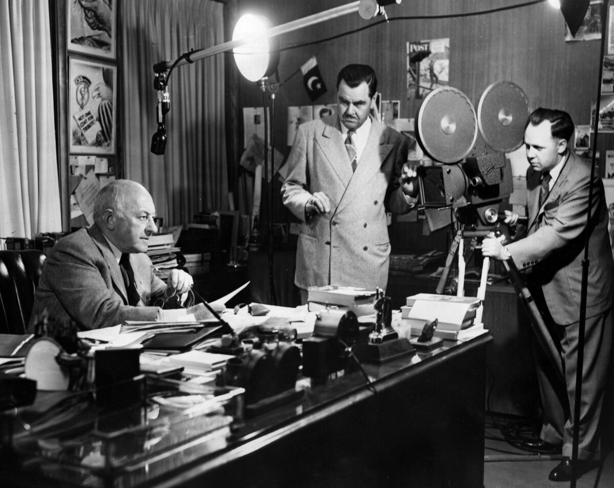 Cecil B. De Mille, left, works on his introduction to “The Fallbrook Story” film. Charles M. Peters, a producer, is in center and Walter Bach is on camera. This photo was published in the June 23, 1952, Los Angeles Times. Paul Calvert