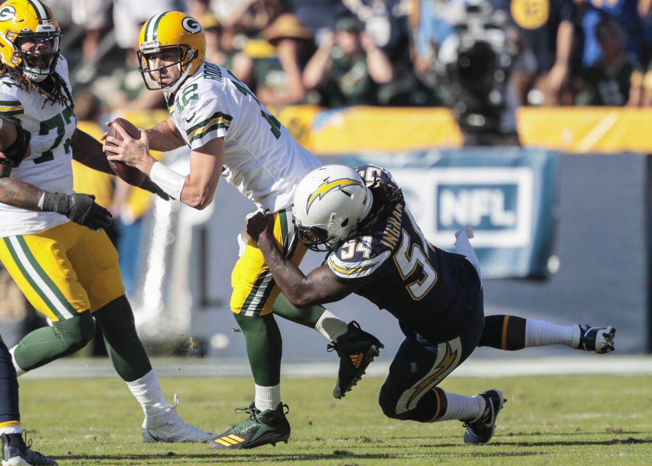 Chargers defensive end Melvin Ingram sacks Packers quarter Aaron Rodgers.