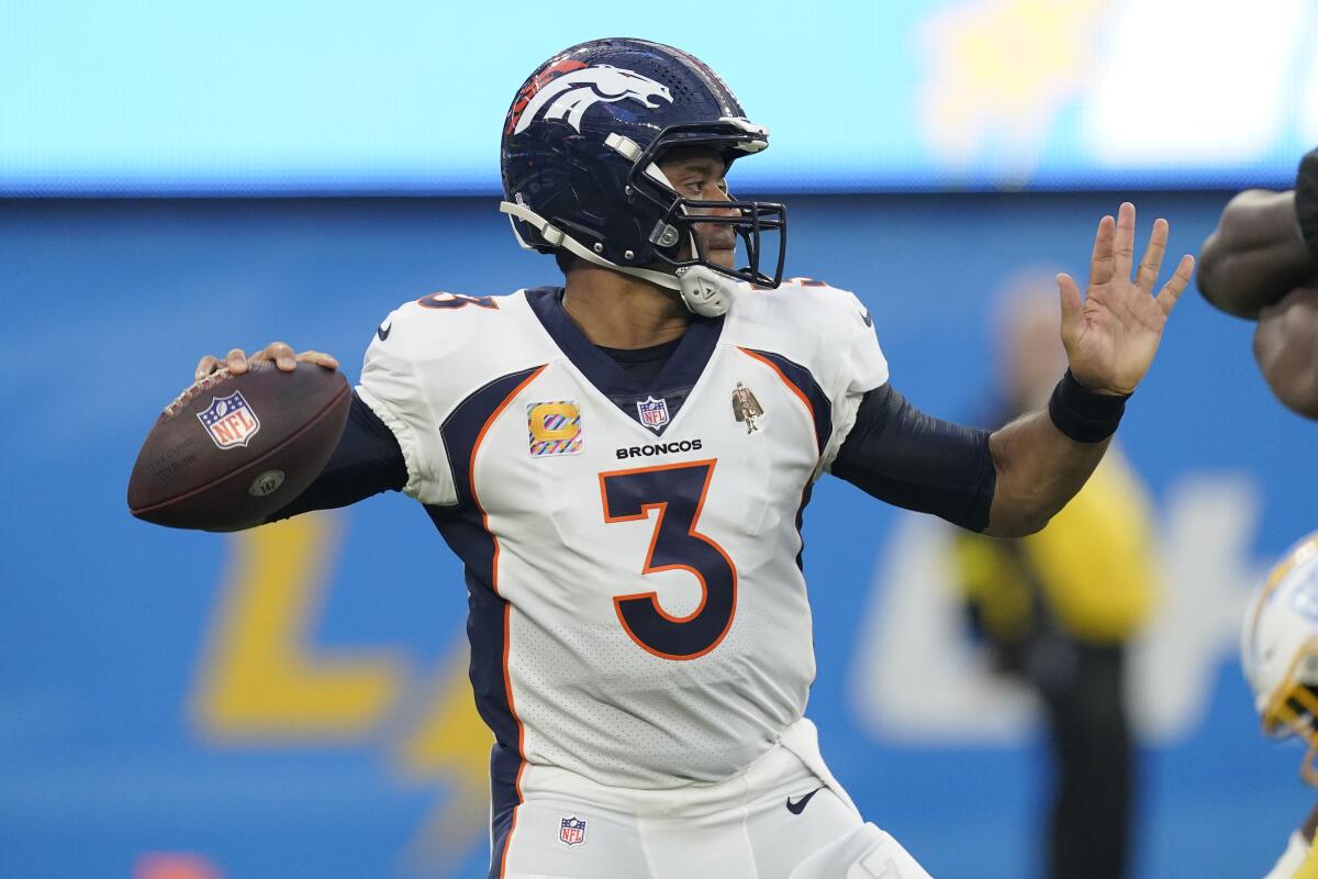 Denver Broncos quarterback Russell Wilson passes against the Chargers in the first quarter.