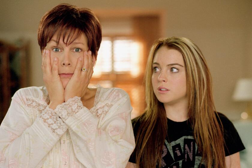 A woman wears a shocked expression while a teenage girl looks on
