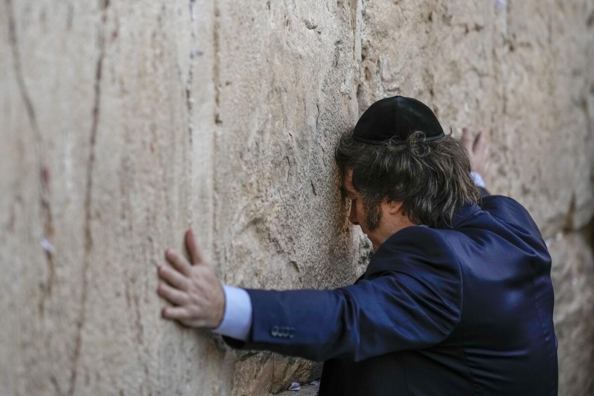 Argentine President Javier Milei prays at the Western Wall in Jerusalem's Old City.