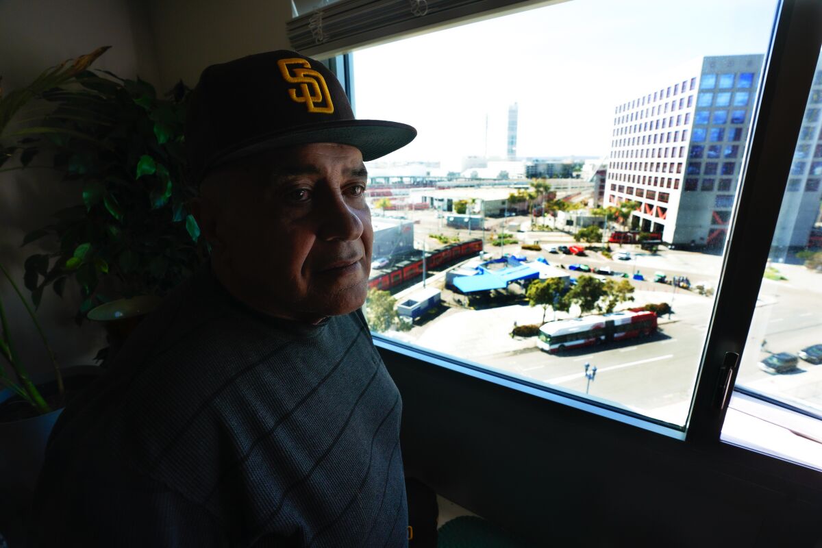 Albert Zuniga looks out from the window of his room at Saint Teresa of Calcutta Villa in downtown San Diego.