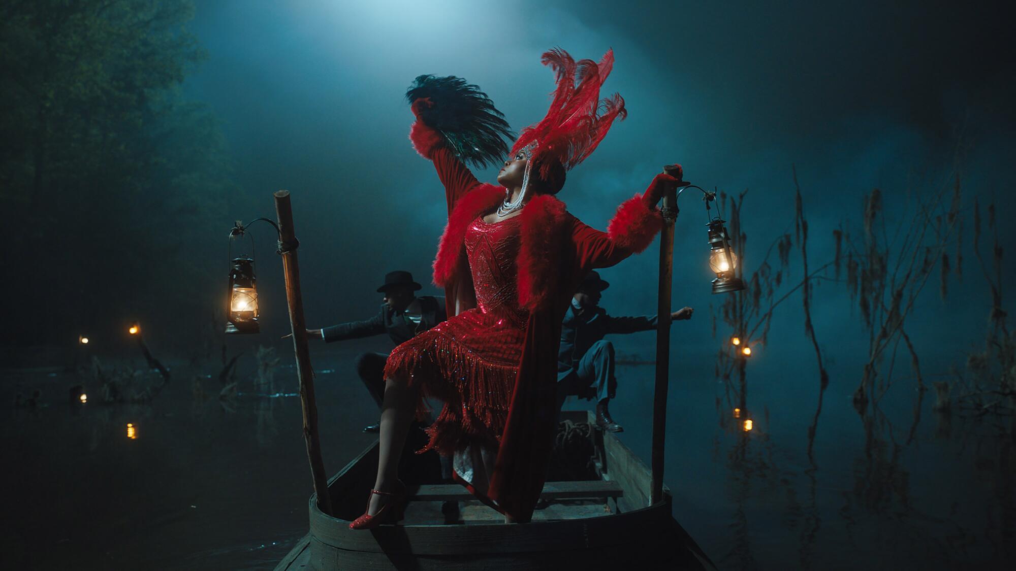 A woman in an ornate red outfit performs.