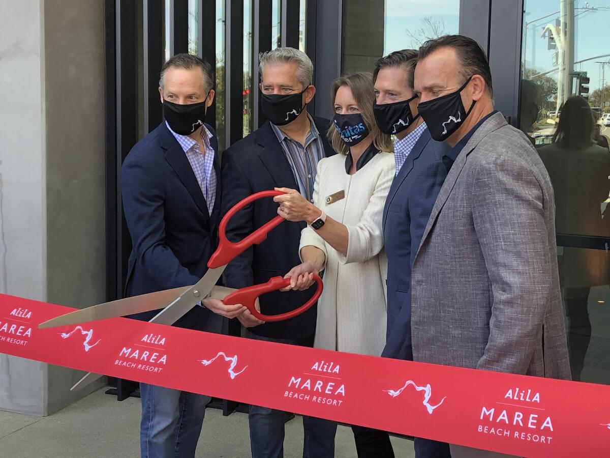 Developers and city officials cut the ribbon March 17 to open Alila Marea in Encinitas.