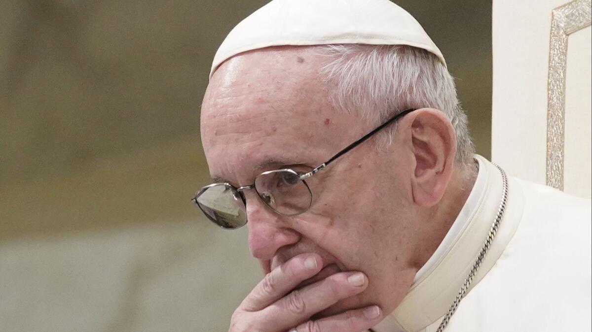 Pope Francis is caught in pensive mood during his weekly general audience at the Vatican on Aug. 22.