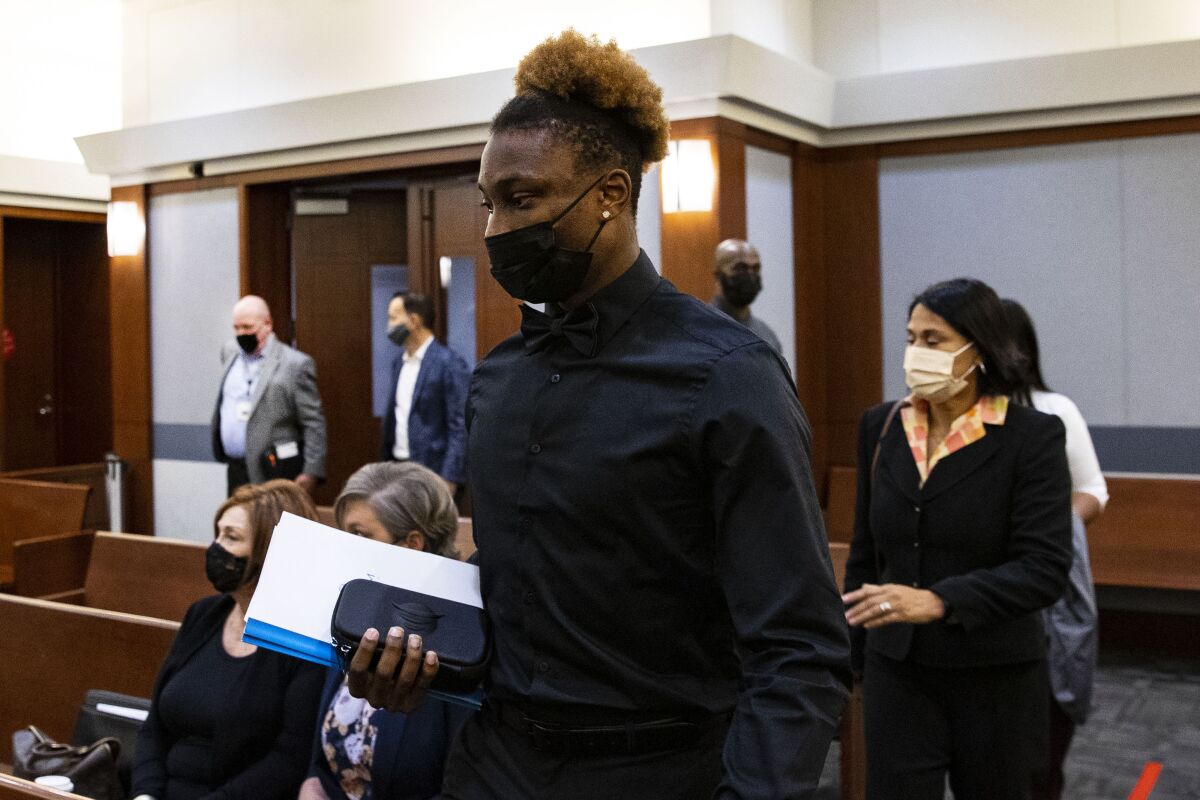 FILE - Former Las Vegas Raiders wide receiver Henry Ruggs III arrives at court during his hearing at the Regional Justice Center, on Nov. 22, 2021, in Las Vegas. The woman who died in a fiery crash that authorities blame on Ruggs driving drunk at racetrack speeds burned to death, the county coroner in Las Vegas said Tuesday, Dec. 14, 2021. (Bizuayehu Tesfaye/Las Vegas Review-Journal via AP, Pool, File)