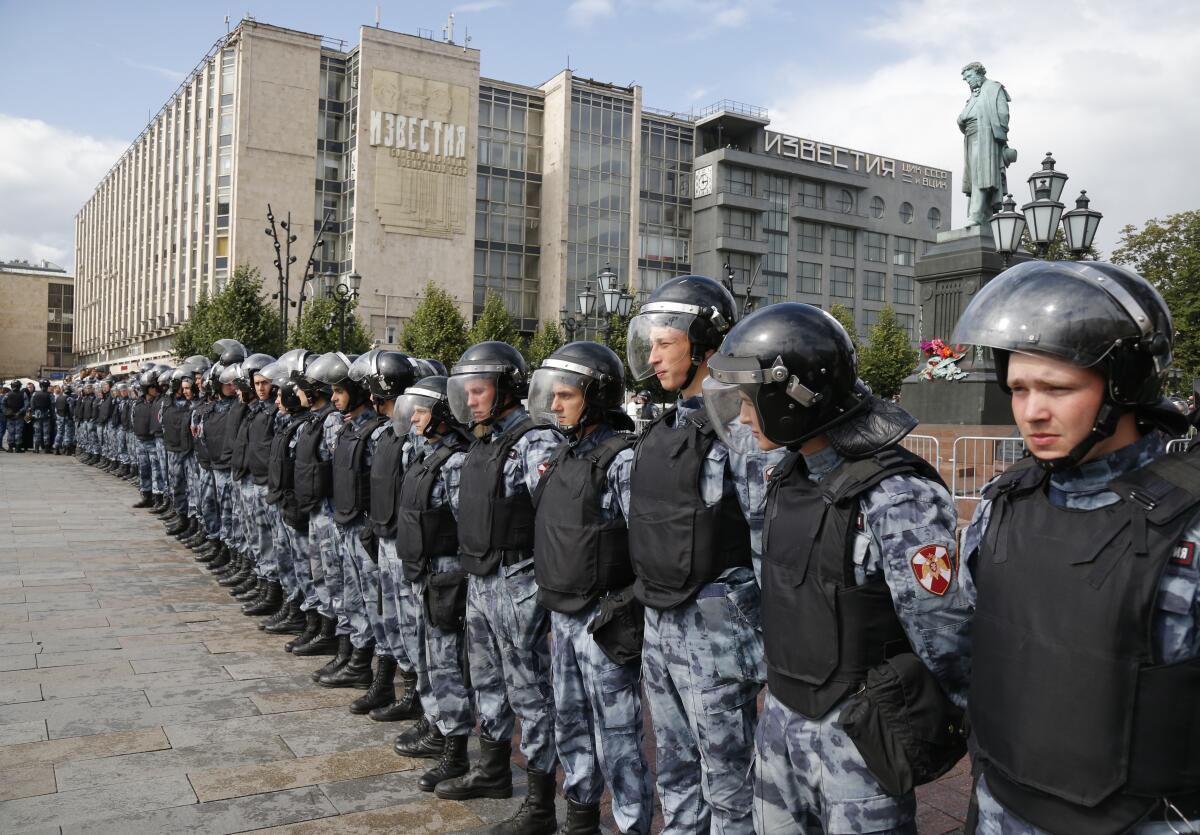 Police block a square during an unsanctioned rally in the center of Moscow on Saturday. Moscow police detained hundreds of people protesting the exclusion of some independent and opposition candidates from the city council ballot, a monitoring group said, a week after arresting nearly 1,400 at a similar protest.