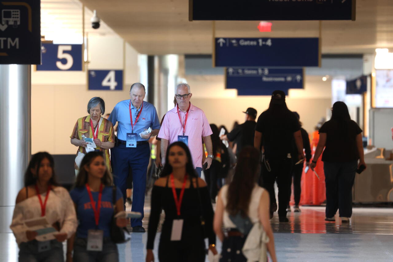 Volunteers, playing passengers, make their way through the Hollywood Burbank Airport in Burbank on September 19, 2026.