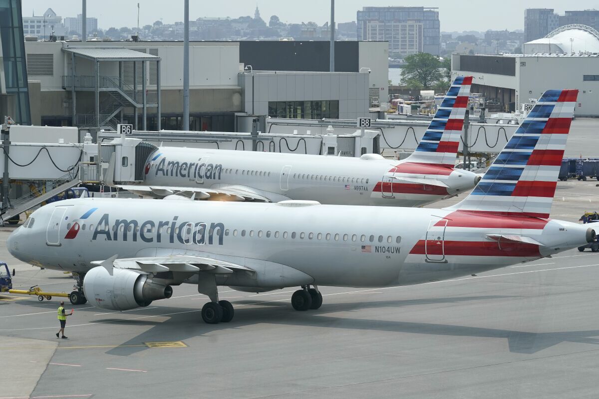 American Airlines passenger jets prepare for departure, Wednesday, July 21, 2021, near a terminal at Boston Logan International Airport, in Boston. American Airlines is still trying to dig out from under a blizzard of cancelled flights over the last few days. By midday Monday, Nov. 1, American had canceled more than 350 flights. It's the fourth straight day of major disruptions at American, which canceled more than 1,000 flights on Sunday.(AP Photo/Steven Senne)