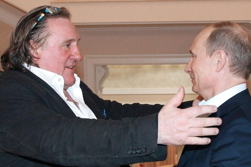Gerard Depardieu, left, and Russian President Vladimir Putin greet each other during a meeting in Putin's residence in Sochi in January 2013 after the French actor had been granted Russian citizenship.