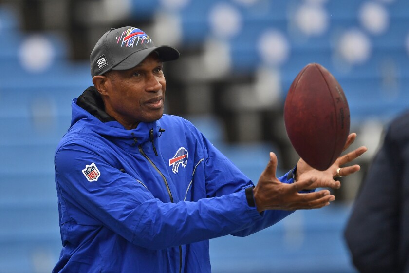 FILE - Buffalo Bills defensive assistant Leslie Frazier catches a ball before an NFL football game against the Houston Texans, Sunday, Oct. 3, 2021, in Orchard Park, N.Y. Leslie Frazier expected another opportunity to be a head coach in the NFL after a three-year-plus stint in Minnesota from 2010-13. Frazier, the Buffalo Bills’ 63-year-old defensive coordinator, is still waiting for that second chance while doing his best to help young coaches advance their careers. (AP Photo/Adrian Kraus, File)