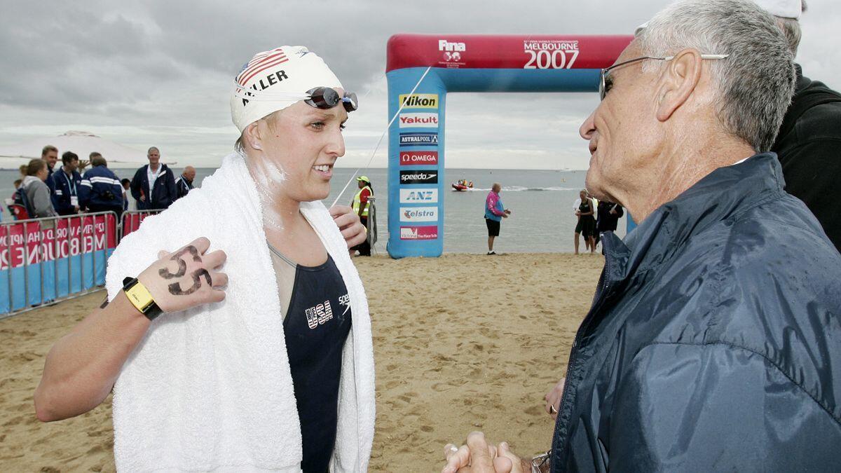 Kalyn Keller, left, talks with U.S. coach Jon Urbanchek after the women's 10-kilometer ocean swim at the FINA World Swimming Championships in Melbourne, Australia, in 2007.