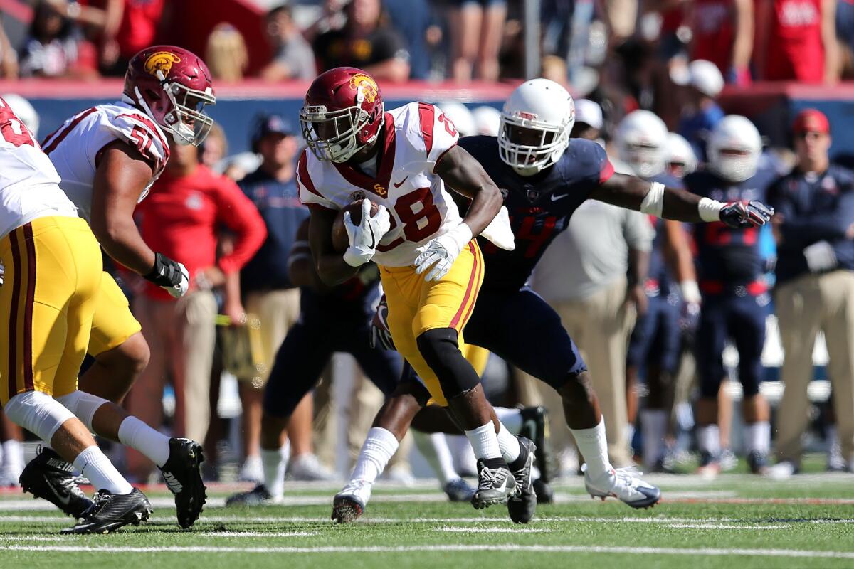 USC running back Aca'Cedric Ware finds running room against Arizona on Saturday.