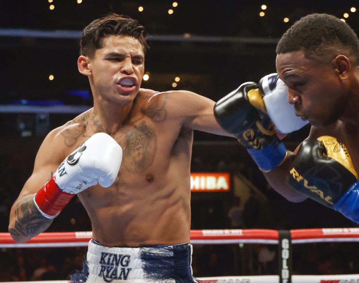 Ryan Garcia, left, fights Javier Fortuna, right, during a lightweight fight in July 2022.