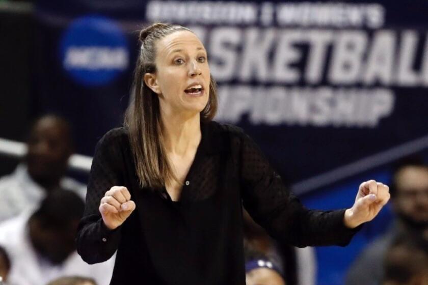 FILE - In this March 23, 2019, file photo, California head coach Lindsay Gottlieb instructs her team in the first half of a first round women's college basketball game in the NCAA Tournament, in Waco, Texas. The Cavaliers have hired former California coach Lindsay Gottlieb as an assistant on John Beilein’s staff. Gottlieb joins Beilein’s staff after serving eight years as the University of California, Berkeley women's basketball head coach, where she led the Golden Bears to a combined 179-89 (.668) record (86-58, .597 in Pac-12) since taking over the helm in 2011-12. (AP Photo/Tony Gutierrez, File)