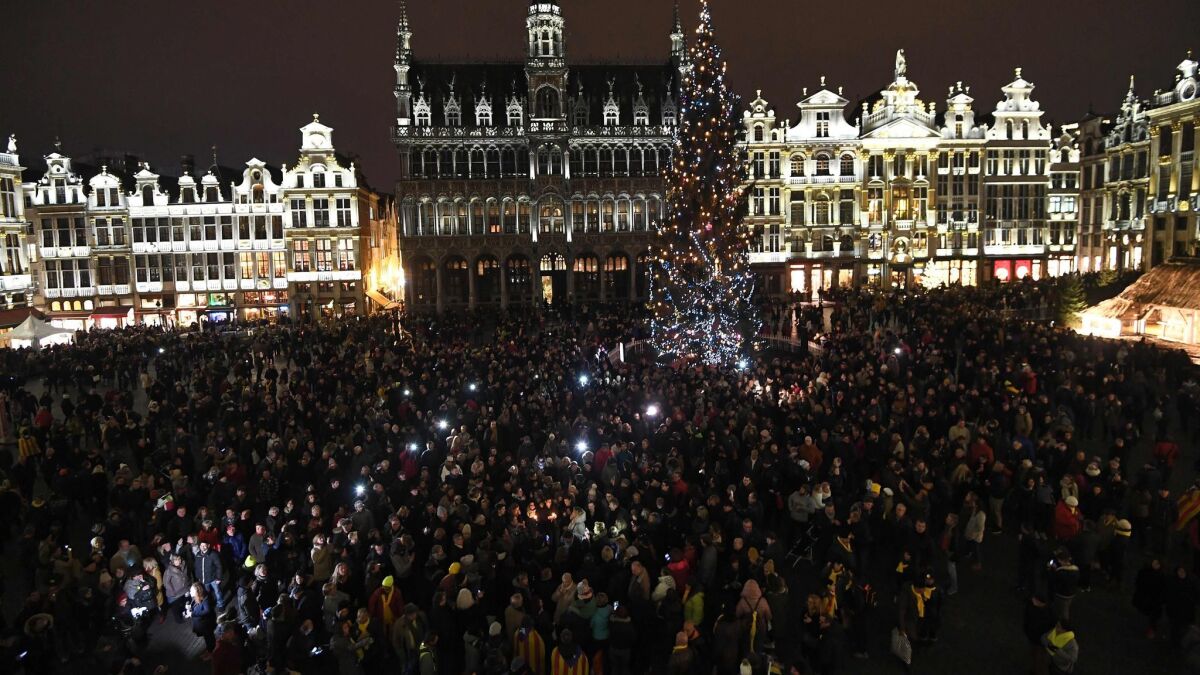 Hundreds of fans of late French rock star Johnny Hallyday gather to pay their respects after the death of the singer on the Grand Place in Brussels on Wednesday.