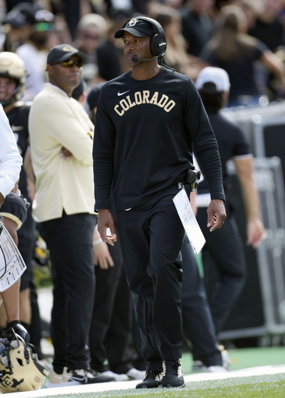 Colorado head coach Karl Dorrell walks the sideline in the first half of an NCAA college football game against Southern California Saturday, Oct. 2, 2021, in Boulder, Colo. Dorrell shoved a television photographer from a Denver CBS affiliate while leaving the field after the loss. (AP Photo/David Zalubowski)