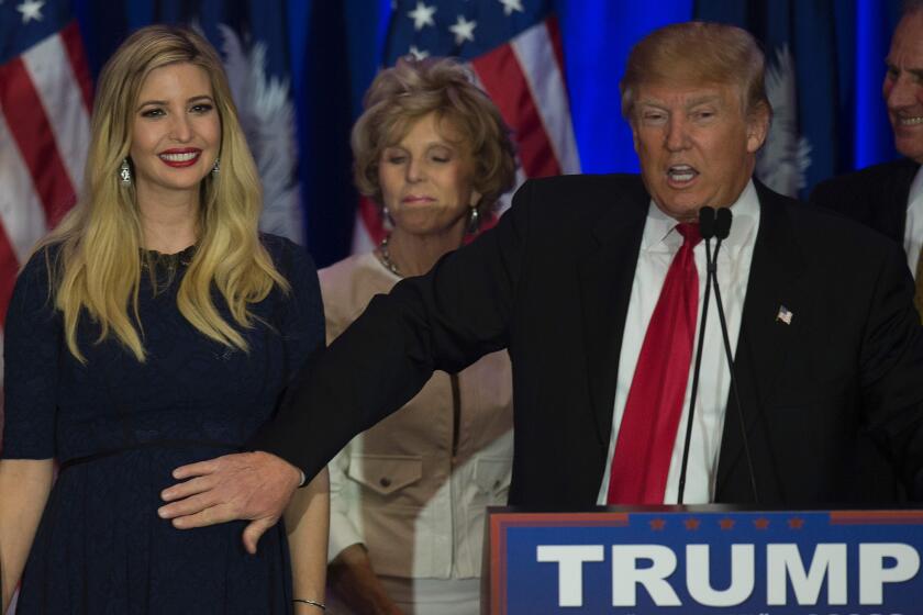Republican presidential candidate Donald Trump pats his expecting daughter Ivanka Trump on Feb. 20 while celebrating victory in the South Carolina primary in Spartanburg. Ivanka gave birth to a boy on Sunday.