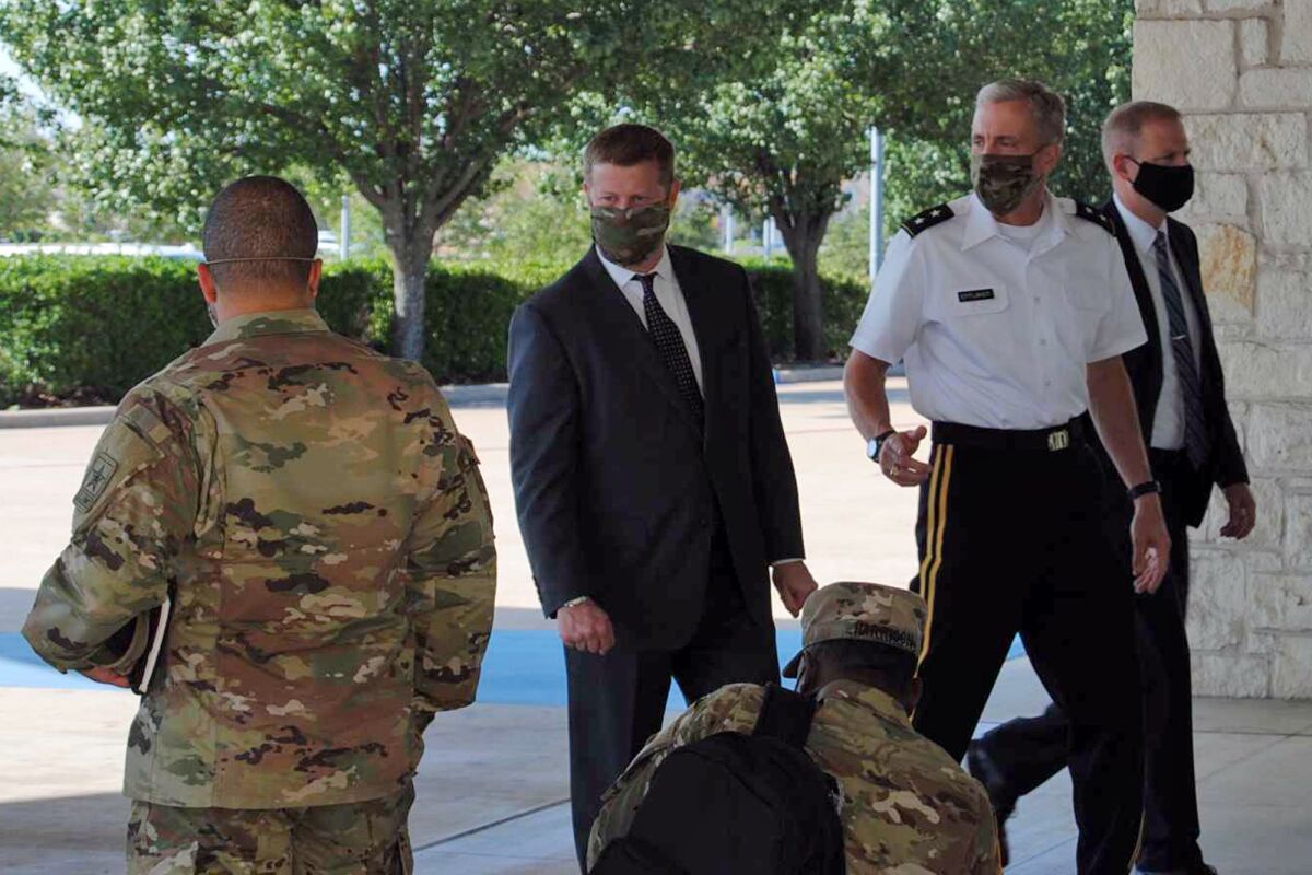 Secretary of the Army Ryan McCarthy, center, into the Killeen Civic and Conference Center Thursday morning, Aug. 6, 2020, ahead of a meeting with local officials in Killeen, Texas. (Hunter King/The Killeen Daily Herald via AP)