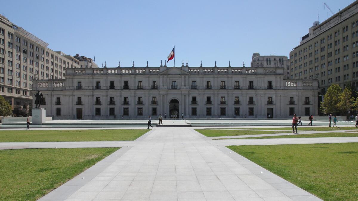 Half a dozen years ago, architect Cristian Undurraga redid the plaza before Chile's presidential palace (above), adding an underground cultural center. That space is now hosting an exhibition from LACMA's permanent collection.
