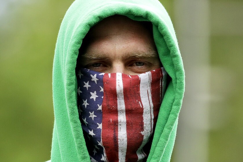 A man wears a mask in Warrensburg, Mo.