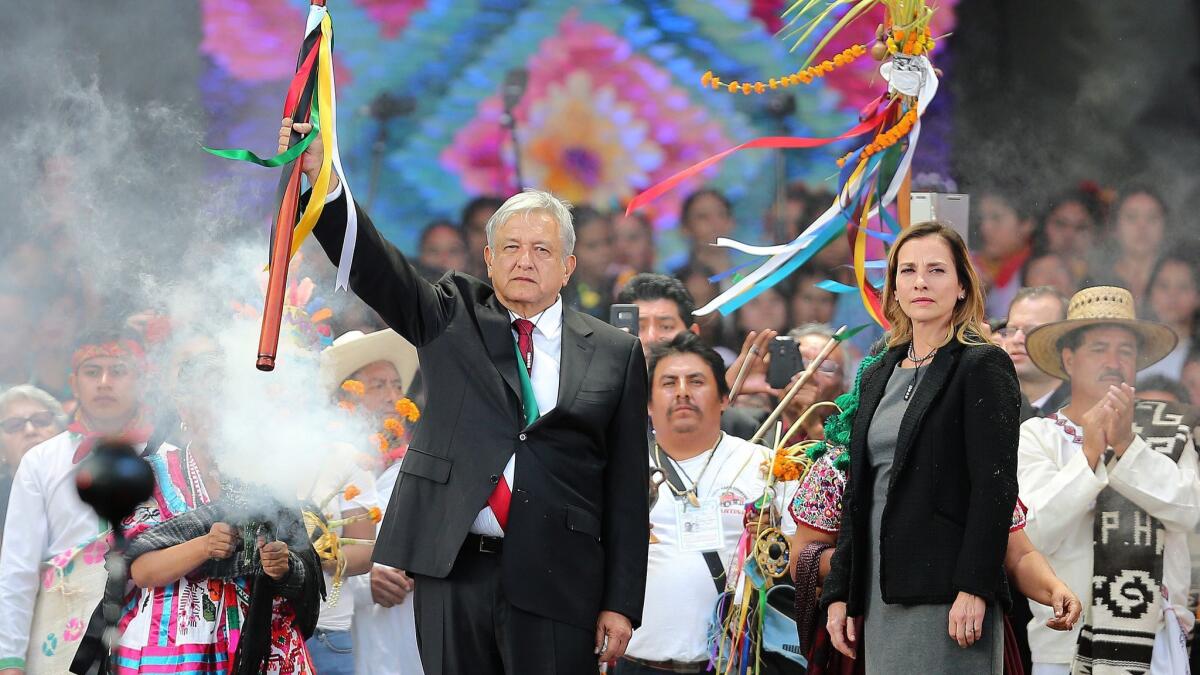 Newly sworn-in Mexican President Andres Manuel Lopez Obrador takes part in an indigenous purification ceremony during his inauguration celebration Saturday in Mexico City.
