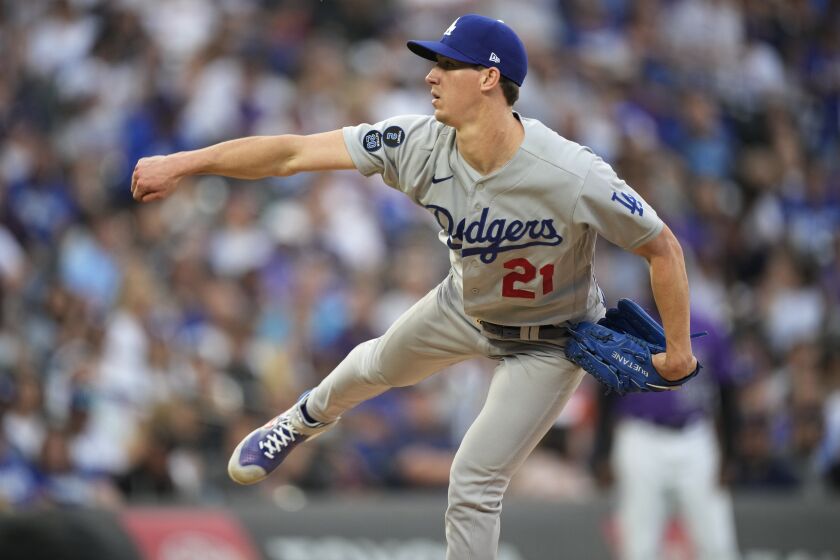 Los Angeles Dodgers starting pitcher Walker Buehler follows through on a delivery to a Colorado Rockies batter during the fifth inning of a baseball game Saturday, July 17, 2021, in Denver. (AP Photo/David Zalubowski)
