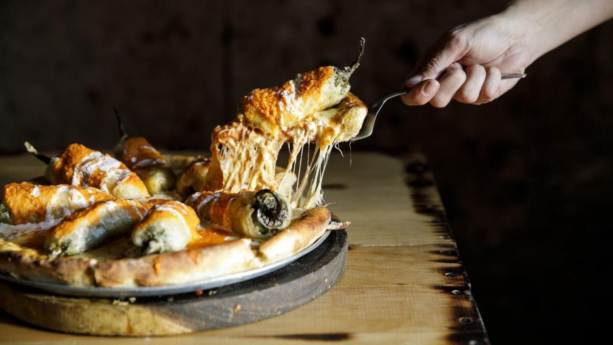 Chile relleno pizza, served at Pizza del Perro Negro in Mexico City.