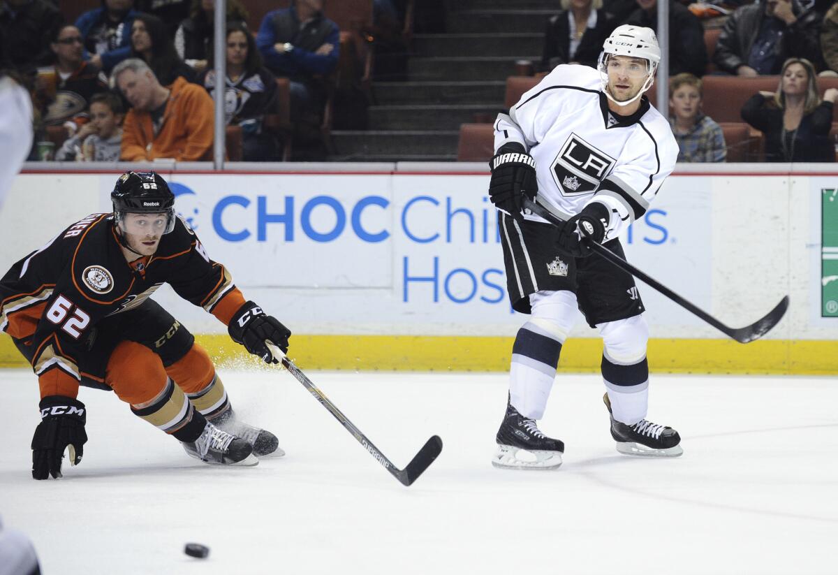 Recently acquired Kings defenseman Andrej Sekera makes a pass in front of Ducks forward Chris Wagner during a game Feb. 27 at Honda Center.