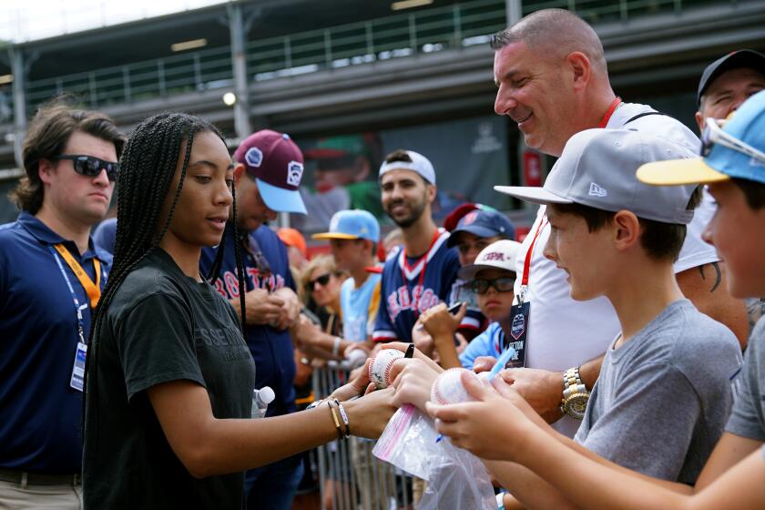 SOUTH WILLIAMSPORT, PA - AUGUST 21: Mo'ne Davis signs autographs at the Little League Complex prior to the Little League Classic on Sunday, August 21, 2022 in South Williamsport, Pennsylvania. (Photo by Jim McKenna/MLB Photos via Getty Images)