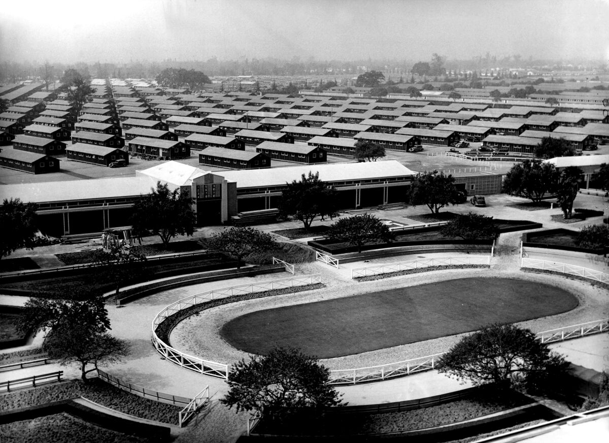 The Santa Anita racetrack with barracks in its parking lot. 