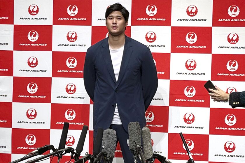FILE - Los Angeles Angels' Shohei Ohtani speaks to reporters after he returned home at the Haneda Airport in Tokyo, Japan, Oct. 18, 2022. Ohtani has been voted the majors' best designated hitter for the second consecutive season. On Monday, Nov. 28, 2022, the Angels' two-way slugger won the Edgar Martinez Outstanding Designated Hitter Award, beating out Houston's Yordan Álvarez as the top player at the position in 2022. (AP Photo/Koji Ueda, File)