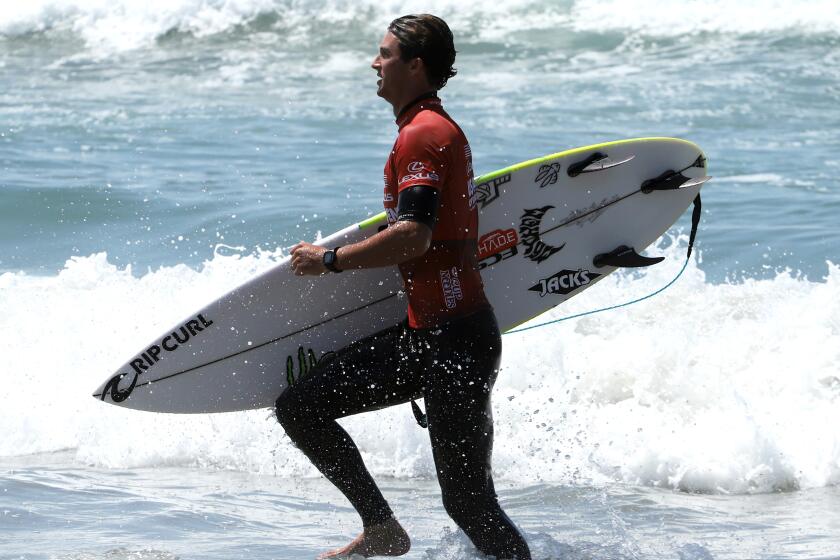 Crosby Colapinto of San Clemente runs to shore.