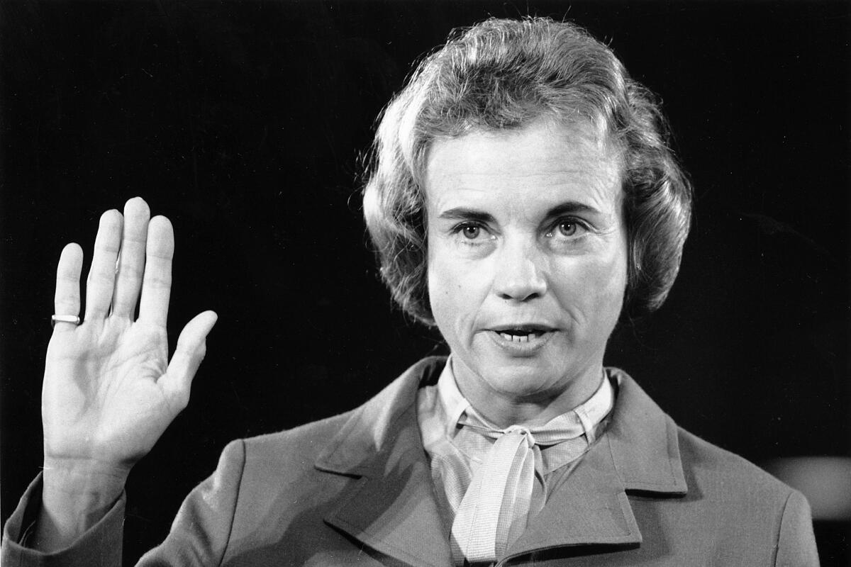 Supreme Court nominee Sandra Day O'Connor raises her right hand to be sworn in