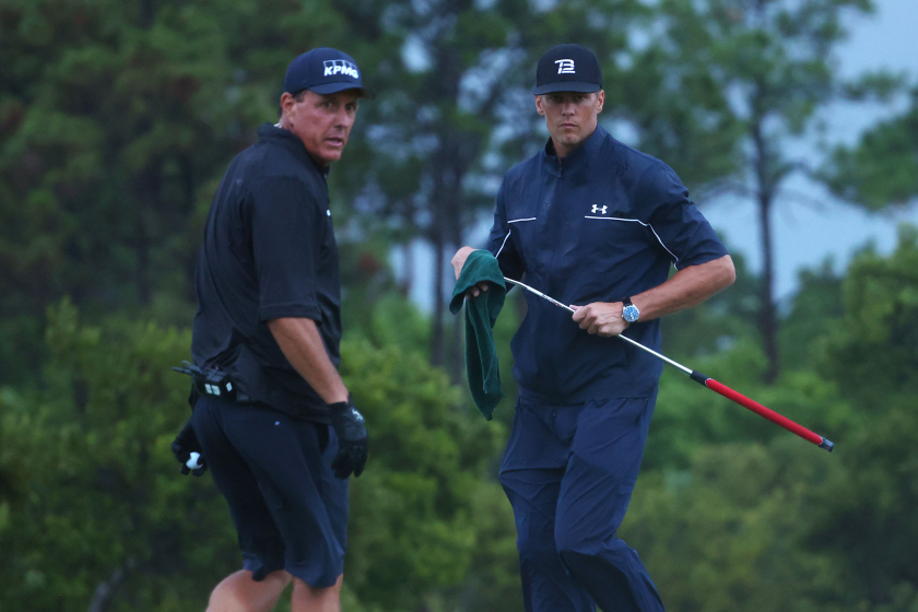 Phil Mickelson, left, reads a putt for Tom Brady during The Match: Champions For Charity.