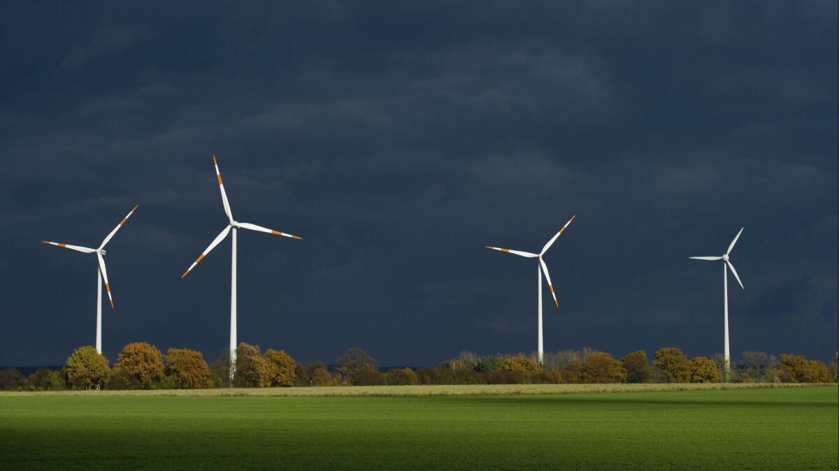 Wind turbines in Furstenwalde, in eastern Germany. Wind power accounts for 160,000 jobs in Germany but the country's integration of renewable energy sources has been less than smooth.
