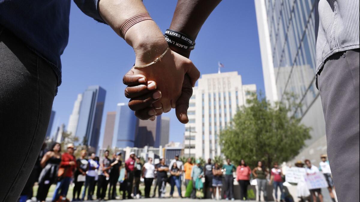 A show of unity during a Black Lives Matter protest in Los Angeles on Oct. 4, 2016.